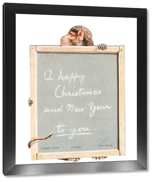 Monkey holding a slate on a cutout Christmas card