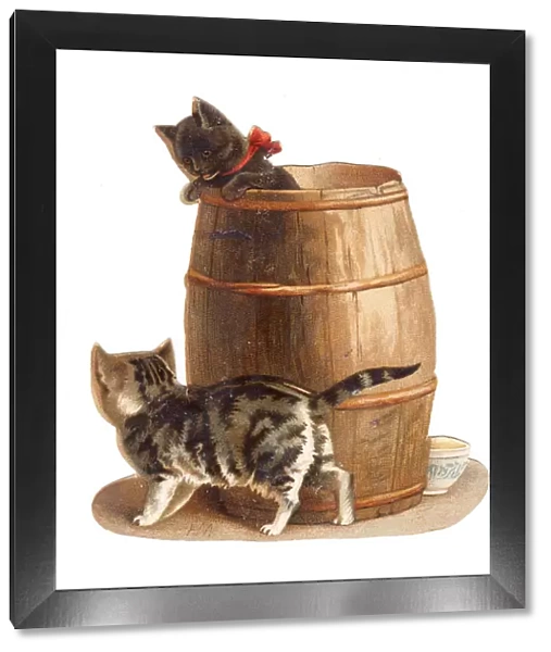 Two kittens with barrel on a cutout Christmas card