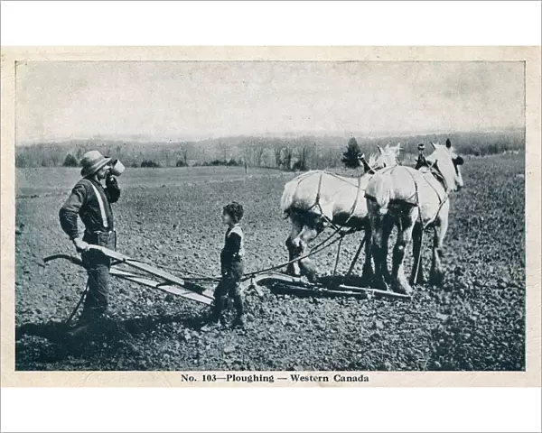 Ploughing in Western Canada - Farmer and son take a break