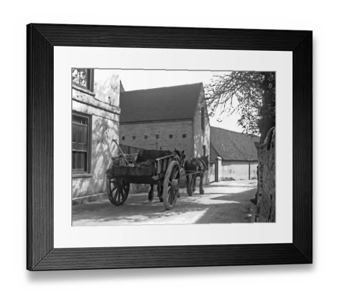 Framed Print : Horses and cart in a village