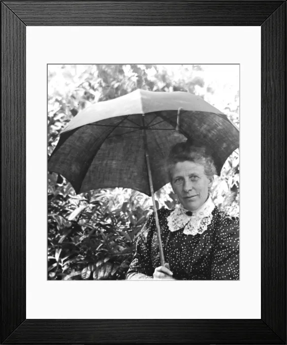 Framed Print : Woman with a parasol in a garden Framed Print : Woman with a parasol in a garden