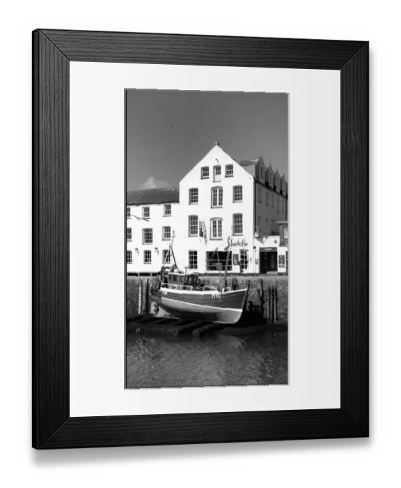 Framed Print : Fishing boat lifted Mevagissey harbour, Cornwall