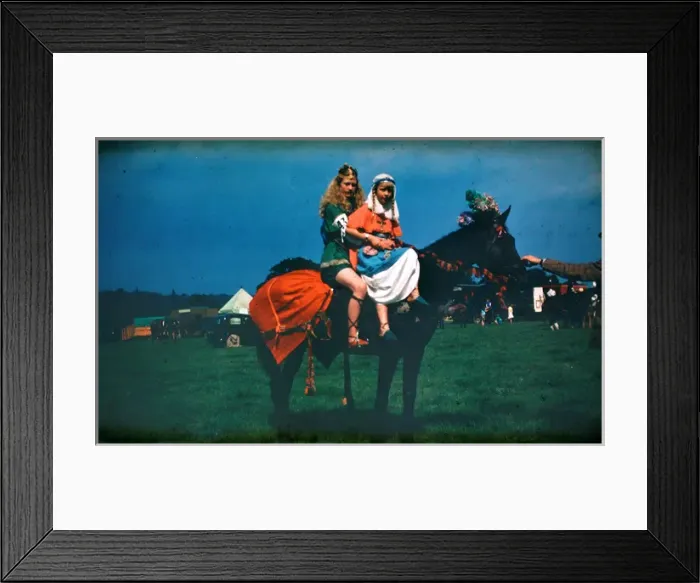 Framed Print : Two girls at a fair in medieval costume on horseback Framed Print : Two girls at a fair in medieval costume on horseback