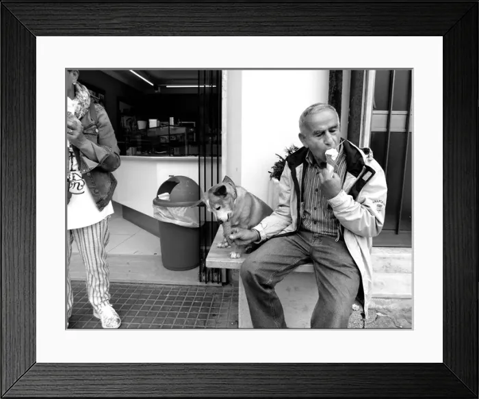 Framed Print : Man and dog both eating ice cream Italy Framed Print : Man and dog both eating ice cream Italy
