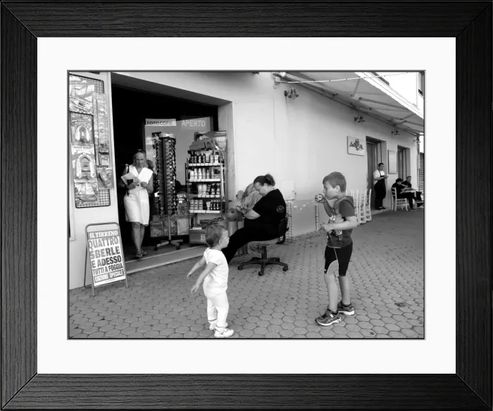 Framed Print : Boy blowing bubbles Italian street Framed Print : Boy blowing bubbles Italian street