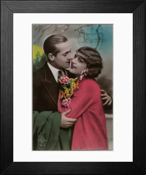 Framed Print : Kitsch New Years Greetings postcard featuring a young couple Framed Print : Kitsch New Years Greetings postcard featuring a young couple