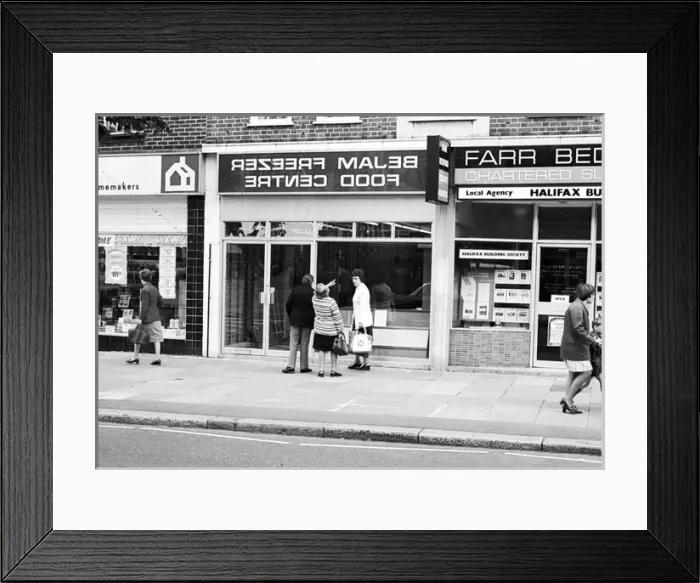 Framed Print : A mistake on a high street shopfront - back to front sign Framed Print : A mistake on a high street shopfront - back to front sign
