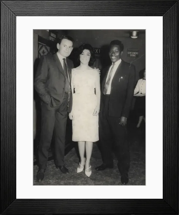 Framed Print : English couple with African man in the foyer of the venue Framed Print : English couple with African man in the foyer of the venue