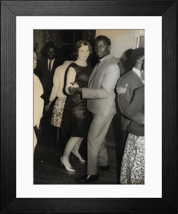 Framed Print : English girl and African man with other people on the dance Framed Print : English girl and African man with other people on the dance