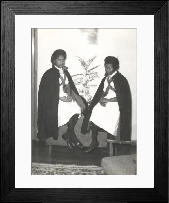 Framed Print : Two black student nurses sitting by a plant in the Womens H Framed Print : Two black student nurses sitting by a plant in the Womens H
