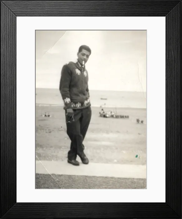 Framed Print : Man with cigarette and knitted cardigan standing on the beac Framed Print : Man with cigarette and knitted cardigan standing on the beac