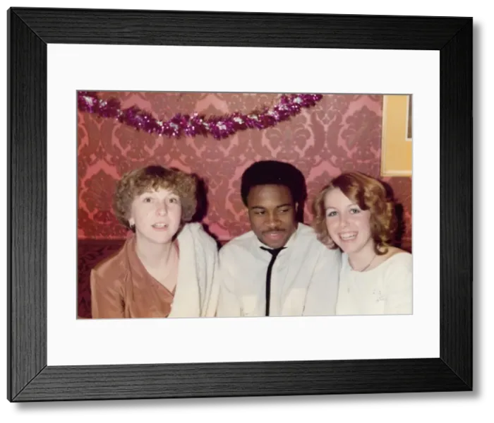 Framed Print : British Caribbean man and English girls at work christmas pa Framed Print : British Caribbean man and English girls at work christmas pa