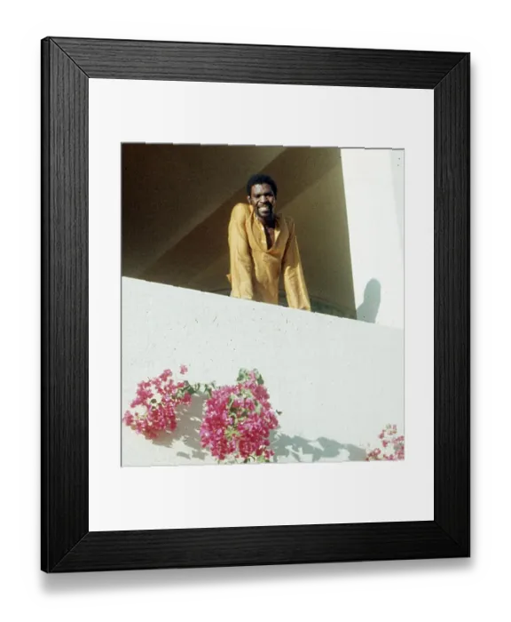 Framed Print : British Caribbean man on balcony at the Holiday Inn Salalah Framed Print : British Caribbean man on balcony at the Holiday Inn Salalah