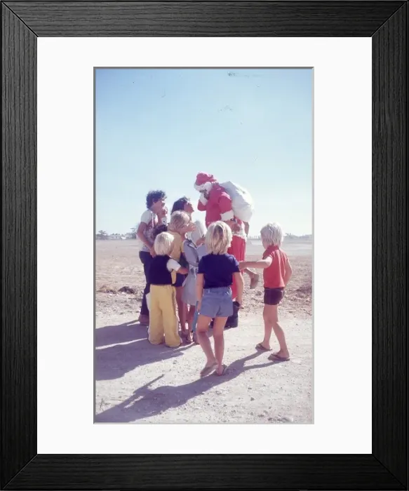Framed Print : Santa Claus in the desert in Oman with British ex - patriate Framed Print : Santa Claus in the desert in Oman with British ex - patriate