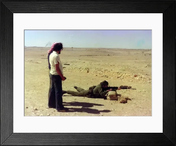 Framed Print : Man in uniform shooting in Oman Framed Print : Man in uniform shooting in Oman