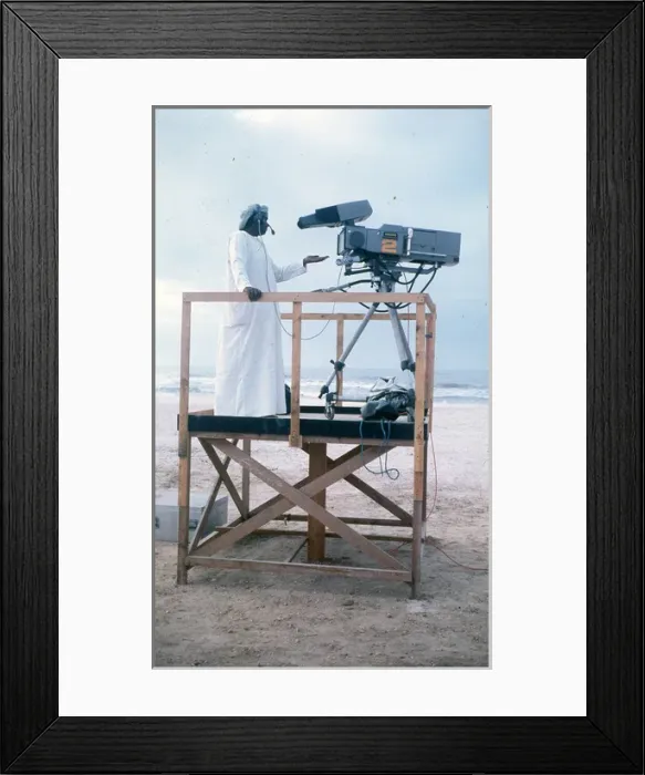Framed Print : Cameraman in Oman on wooden platform Framed Print : Cameraman in Oman on wooden platform