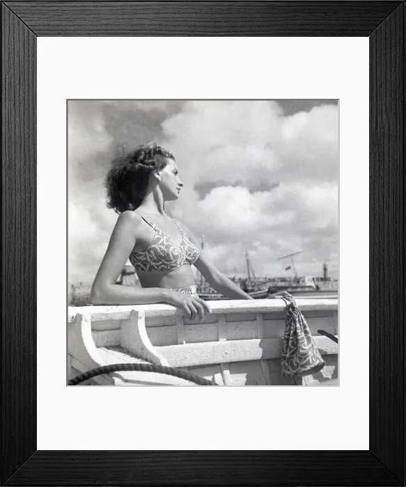 Framed Print : Woman looking out to sea