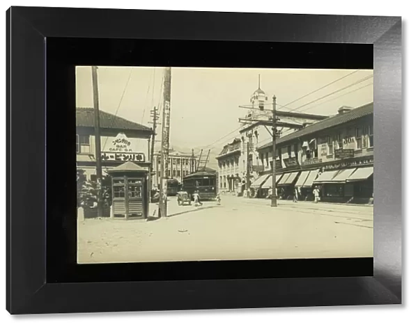 Street scene with trams and shops, Kobe, Japan