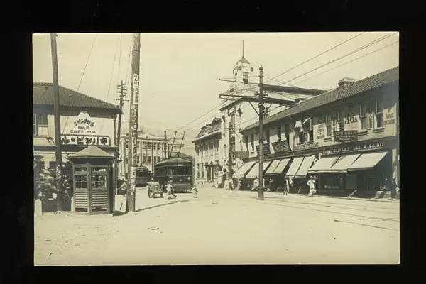 Street scene with trams and shops, Kobe, Japan