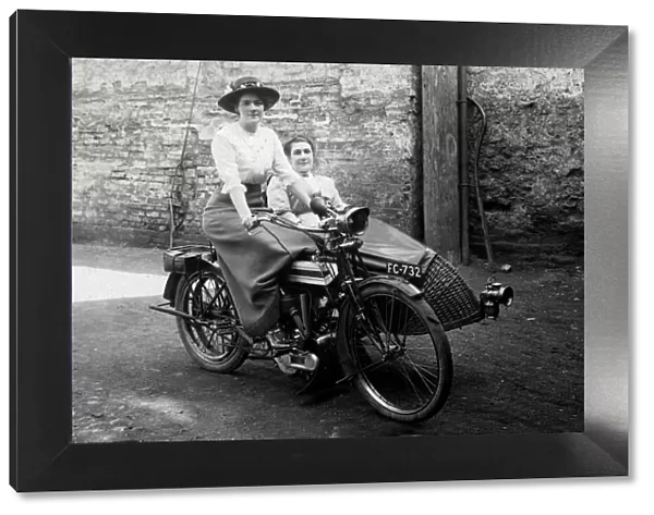 Two ladies on a 1914 Triumph motorcycle