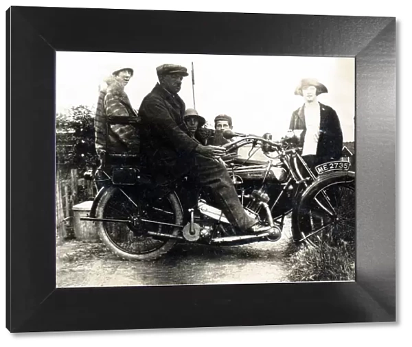 Man sitting on a 1921  /  22 Blackburne motorcycle & sidecar