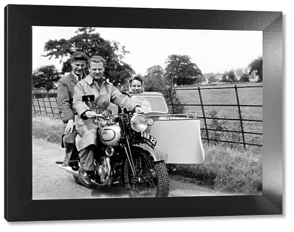 People on a 1939 Norton motorcycle & sidecar