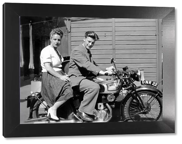 Man & woman on a 1939 Norton motorcycle