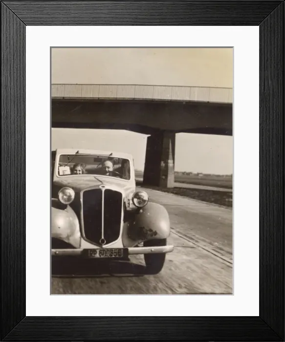 Framed Print : Two people in a car on the Autobahn, Germany Framed Print : Two people in a car on the Autobahn, Germany