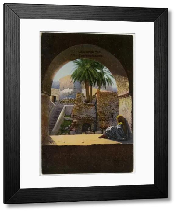 Framed Print : Contemplation - Young child sits beneath an arch - Tunisia Framed Print : Contemplation - Young child sits beneath an arch - Tunisia