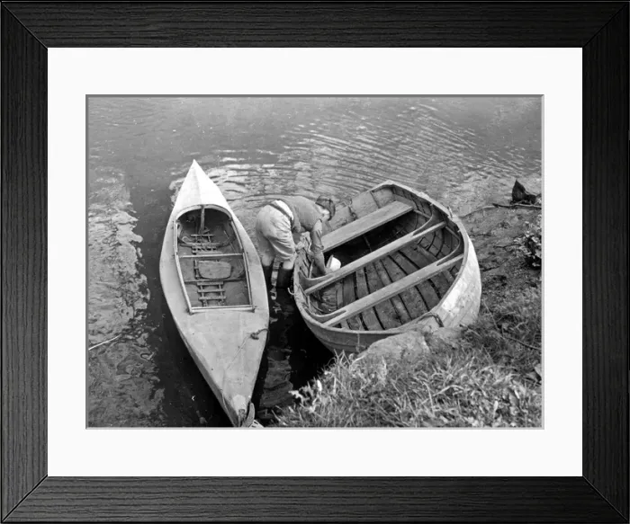 Framed Print : Bailing out water from a boat Framed Print : Bailing out water from a boat