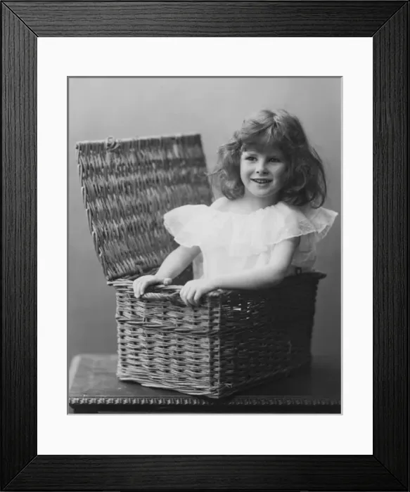 Framed Print : Young girl in wicker basket Framed Print : Young girl in wicker basket