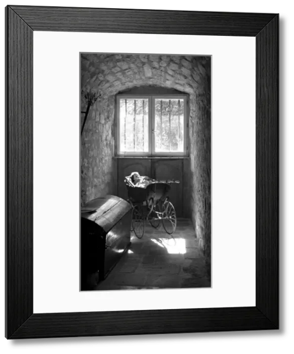 Framed Print : Pram in an antique gallery, France Framed Print : Pram in an antique gallery, France