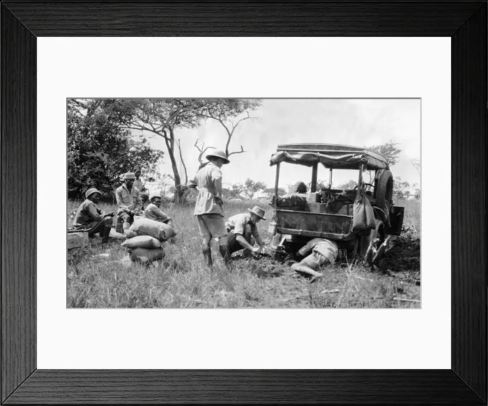 Framed Print : Repairs to a vehicle while on safari, Africa Framed Print : Repairs to a vehicle while on safari, Africa