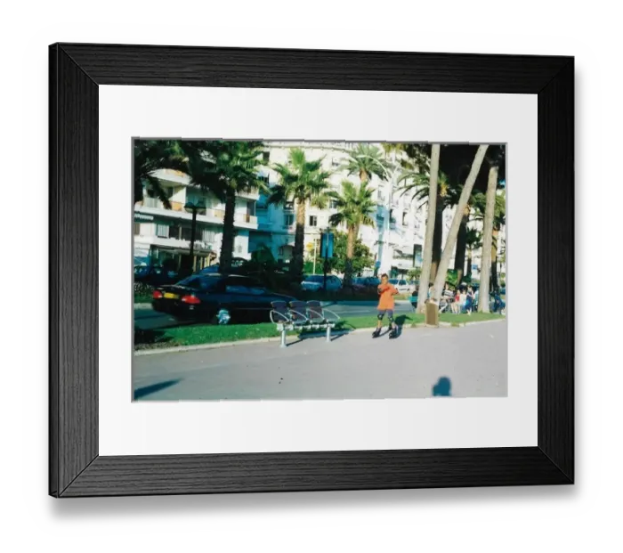 Framed Print : British Caribbean Heritage - Boy roller skating in Cannes, F Framed Print : British Caribbean Heritage - Boy roller skating in Cannes, F
