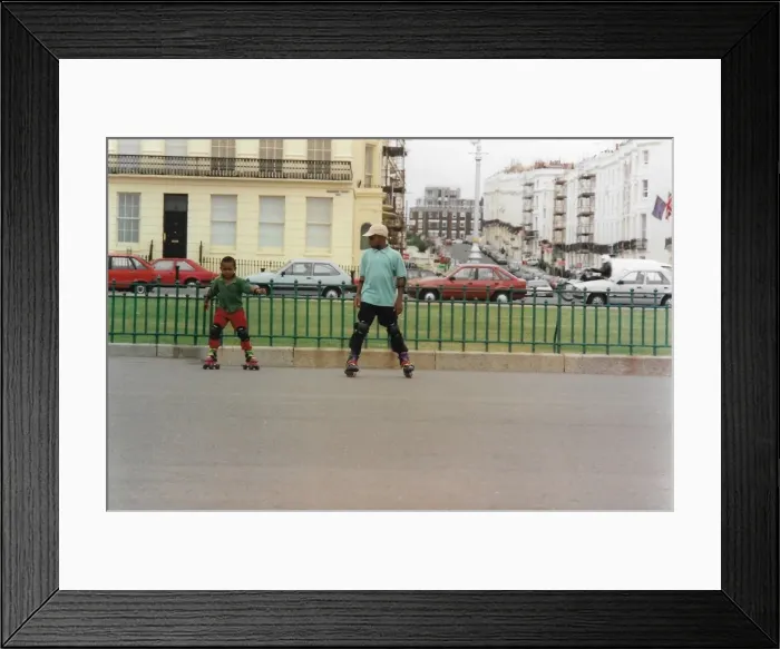 Framed Print : Two British Caribbean boys roller skating in Brighton Engla Framed Print : Two British Caribbean boys roller skating in Brighton Engla