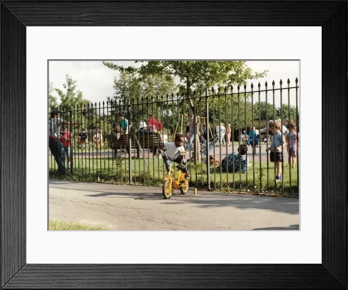 Framed Print : British Caribbean Heritage - Boy mounting his yellow bike Framed Print : British Caribbean Heritage - Boy mounting his yellow bike