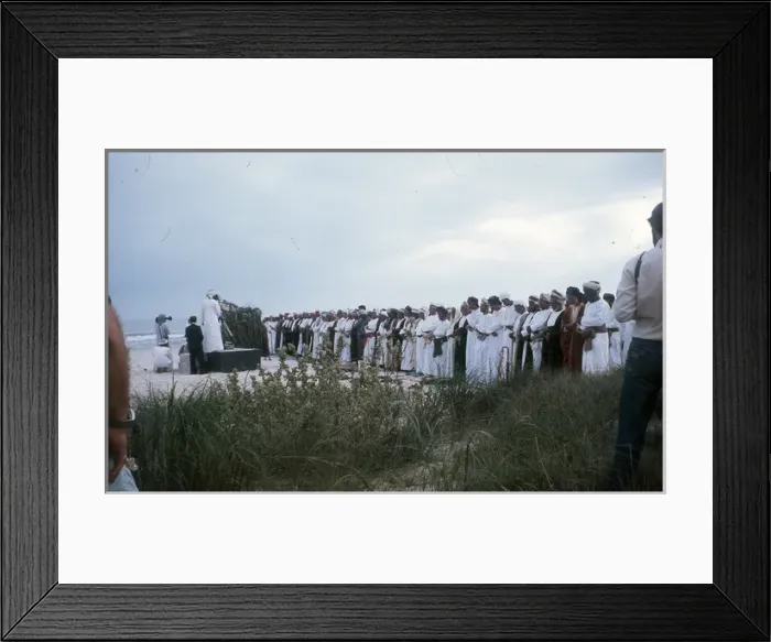 Framed Print : Men stand praying by the beach in Oman Framed Print : Men stand praying by the beach in Oman
