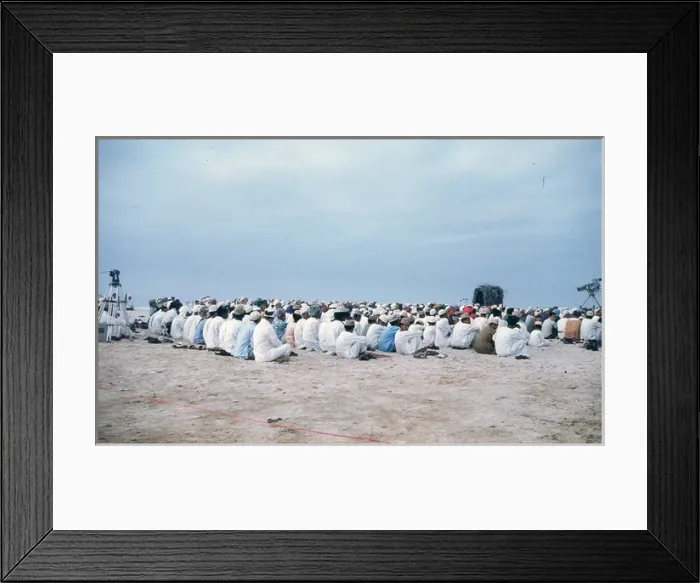 Framed Print : Men and young boys sitting on the beach in Oman Framed Print : Men and young boys sitting on the beach in Oman