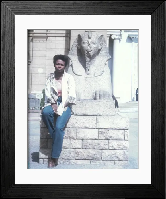 Framed Print : Lorna Holder sitting by a Sphinx-like statue - Egyptian Muse Framed Print : Lorna Holder sitting by a Sphinx-like statue - Egyptian Muse