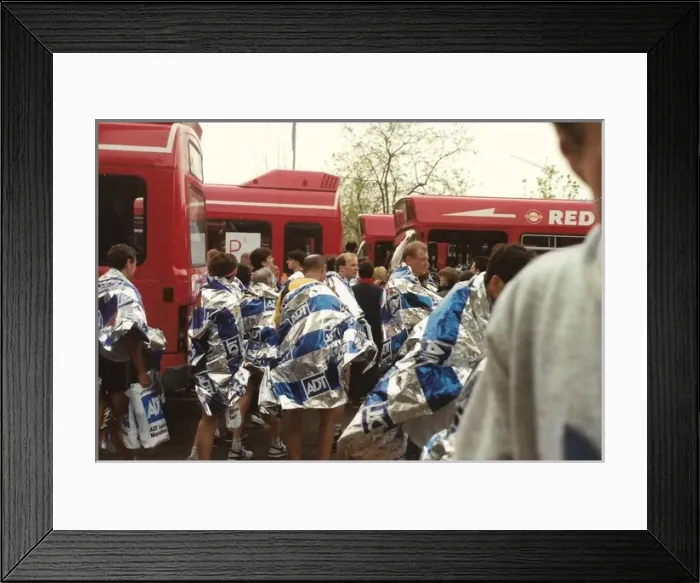Framed Print : Marathon runners with silver white and blue ADT foil wraps Framed Print : Marathon runners with silver white and blue ADT foil wraps