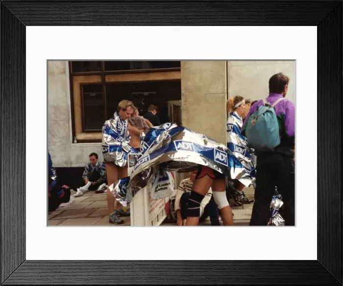 Framed Print : Marathon runners changing on the pavement Framed Print : Marathon runners changing on the pavement