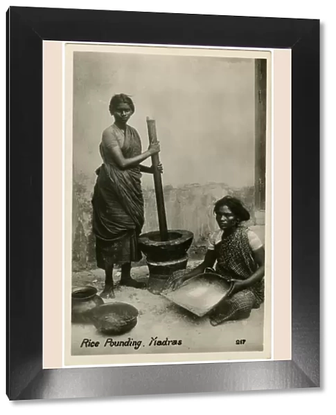 Pounding Rice using large pestle and mortar - Chennai, India