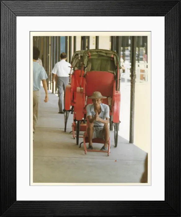 Framed Print : Elderly Chinese man in an empty red rickshaw Framed Print : Elderly Chinese man in an empty red rickshaw