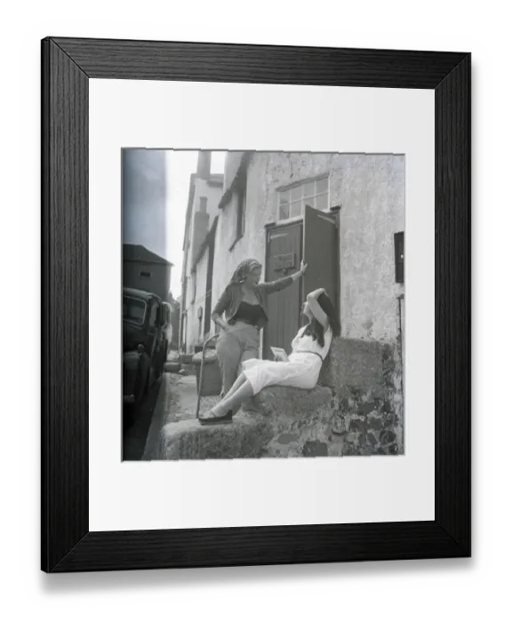 Framed Print : Girls chatting on the steps of The Cabin, St Ives, Cornwall Framed Print : Girls chatting on the steps of The Cabin, St Ives, Cornwall