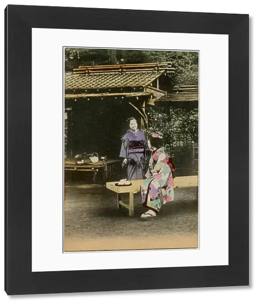 A Japanese Geisha girl taking tea in a garden