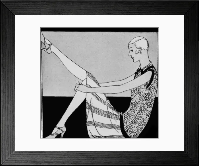 Framed Print : 1920s woman admiring her shoes Framed Print : 1920s woman admiring her shoes