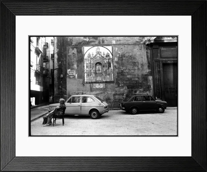 Framed Print : Woman resting on chair outside church, Valencia, Spain Framed Print : Woman resting on chair outside church, Valencia, Spain