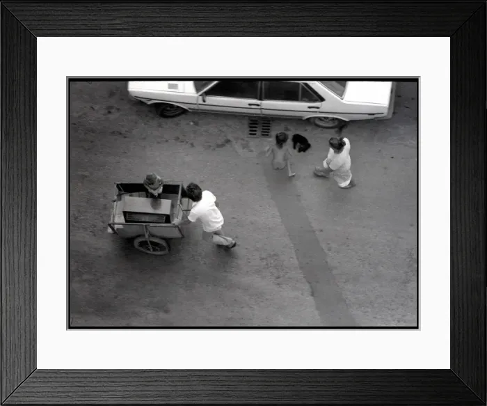 Framed Print : Family with cart in street, Valencia, Spain Framed Print : Family with cart in street, Valencia, Spain