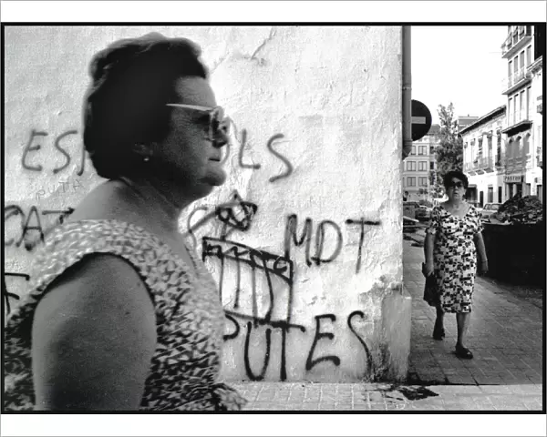 Two women and grafitti, Spain