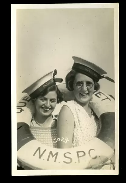 Two women with lifebelt and sailors caps